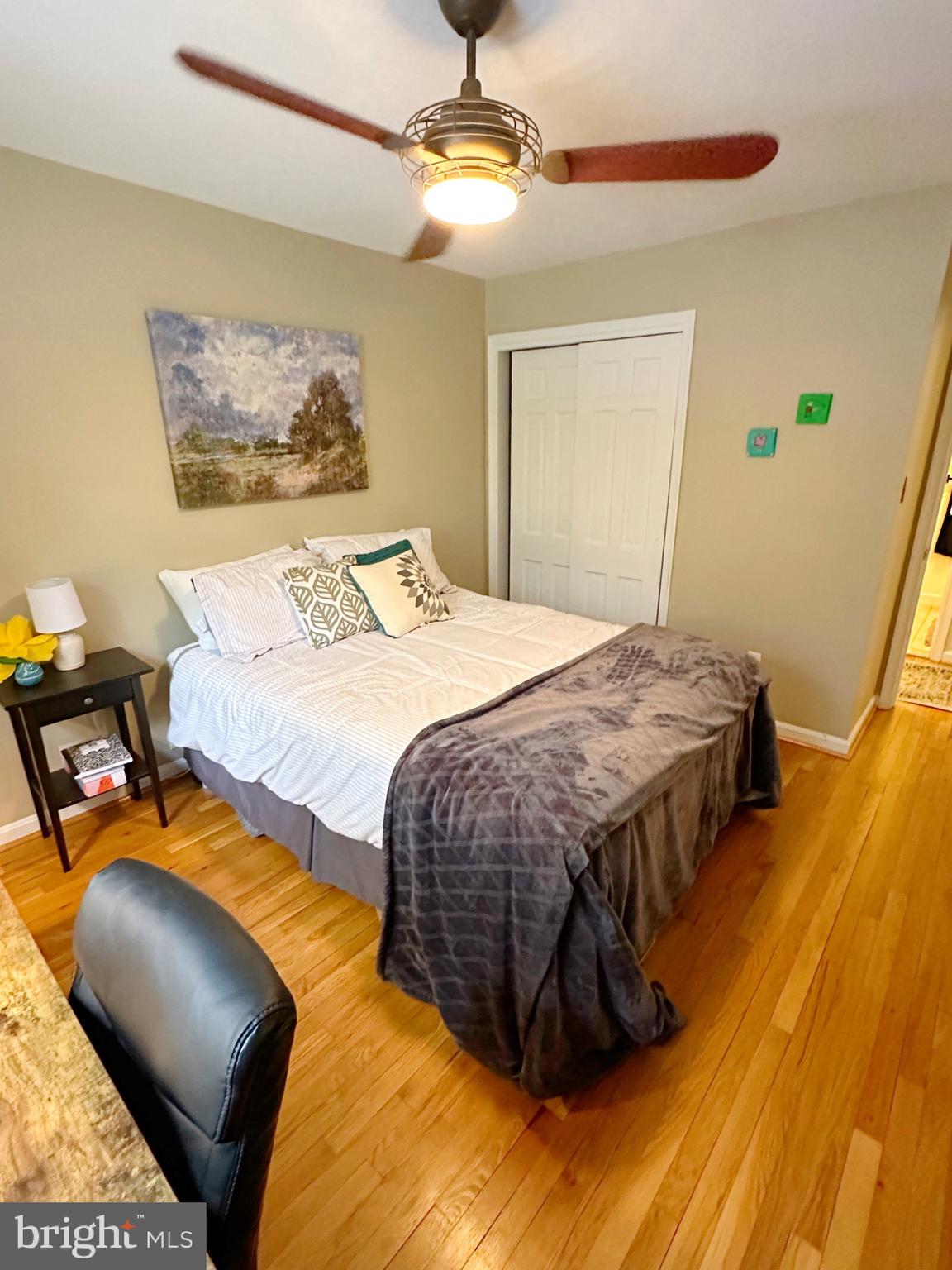 422 Old Courthouse Road Northeast Vienna, VA 22180 - Photo 13 of 25 Cozy bedroom with warm wooden accents.