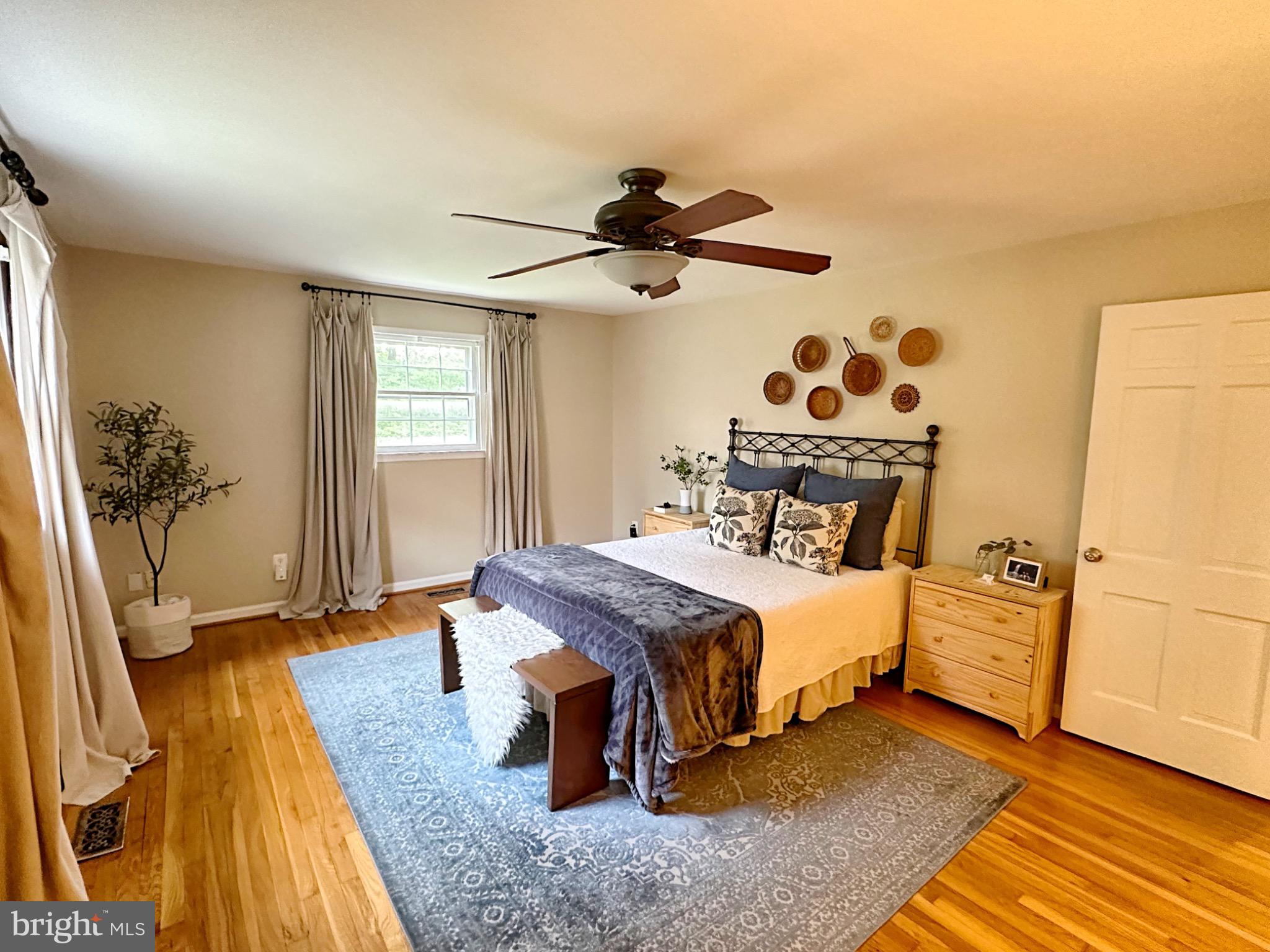 422 Old Courthouse Road Northeast Vienna, VA 22180 - Photo 16 of 25 Serene bedroom with natural light and charm.