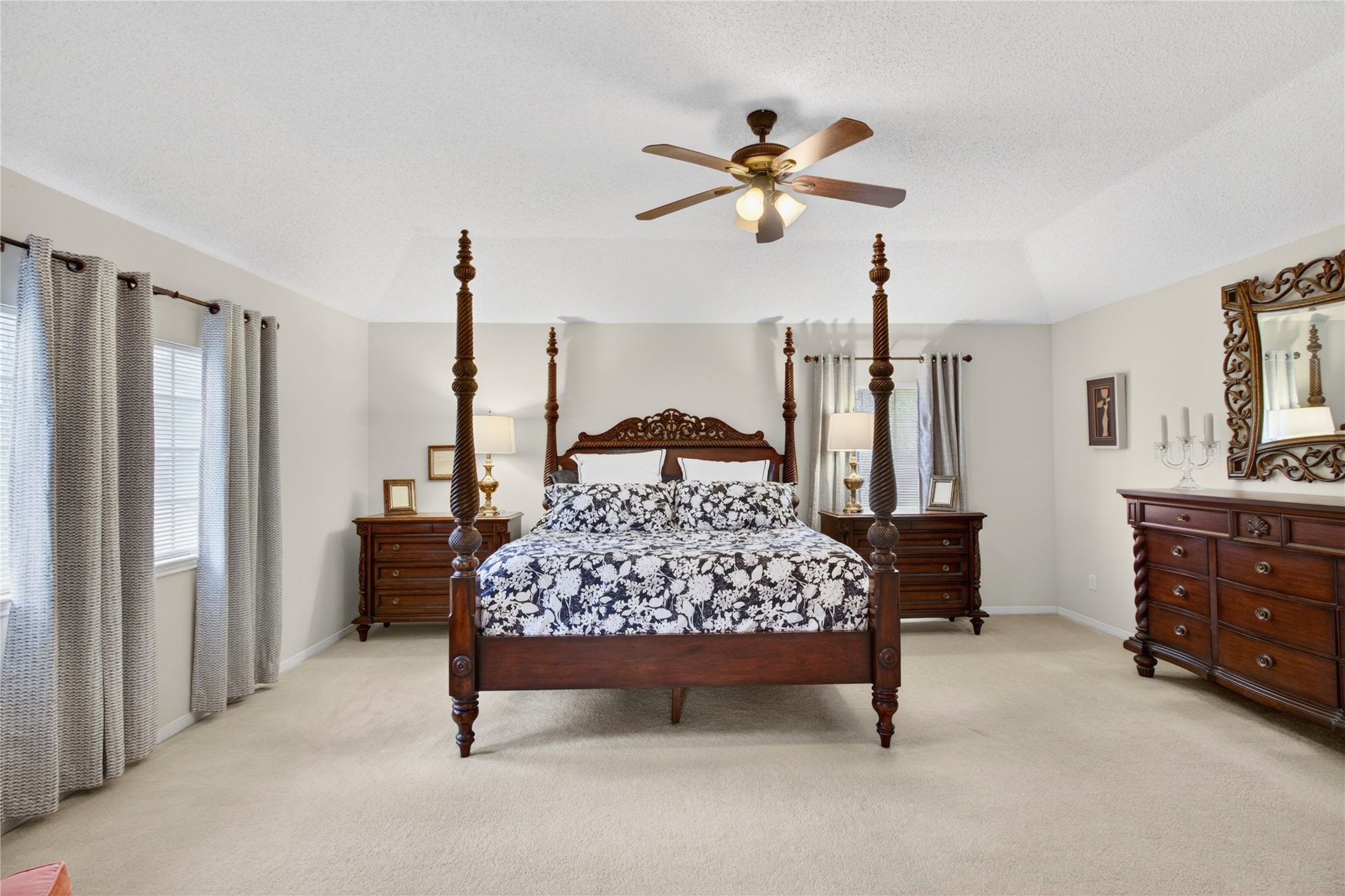 20214 Woodsboro Court Spring, TX 77388 - Photo 29 of 50 HUGE Primary Dream Suite! Plenty of room for your largest furniture! Gambrel Ceiling w/Recently updated Ceiling Fan! Double Doors lead to Ensuite Bath!