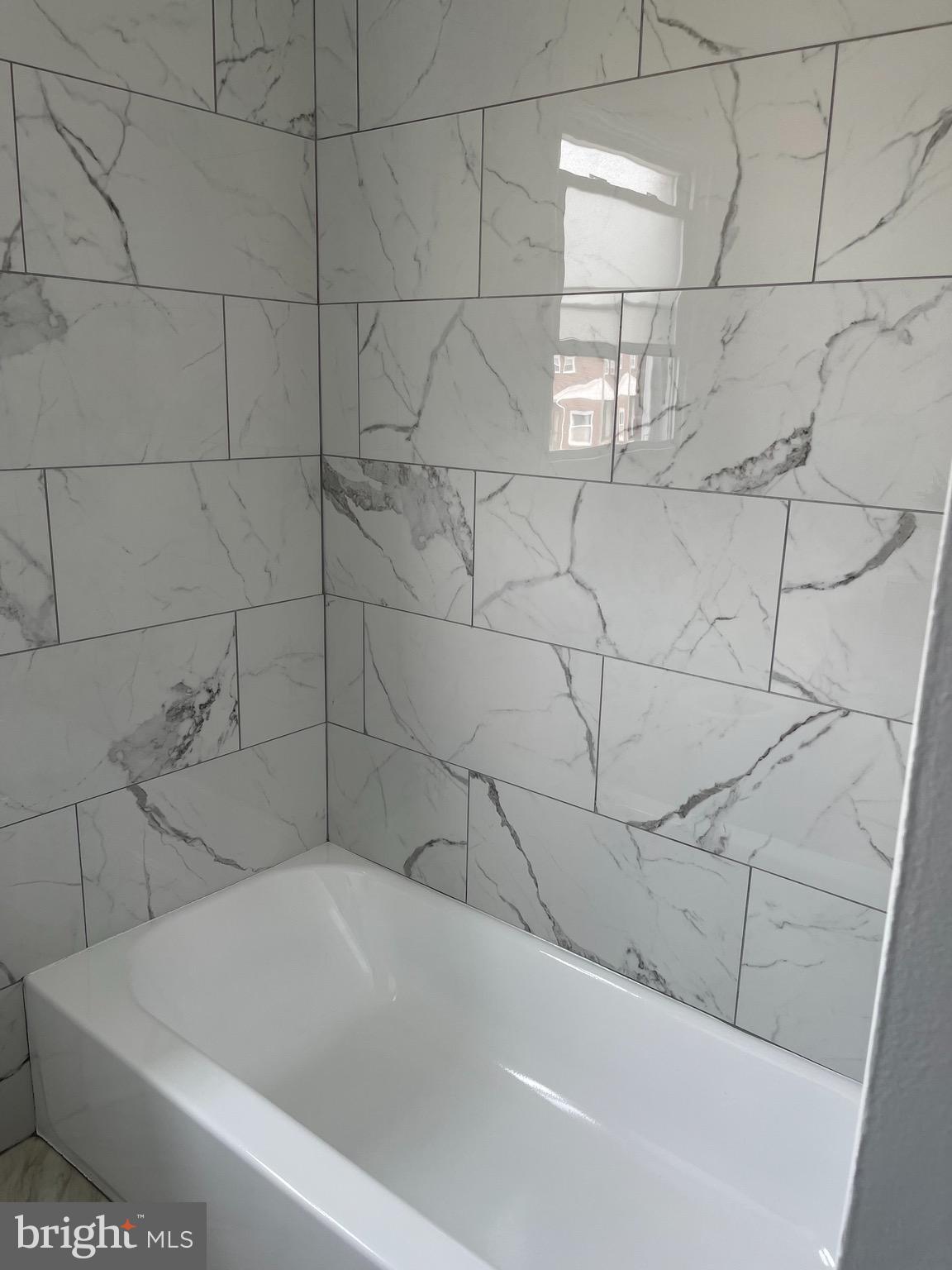 6934 Blanche Road Baltimore, MD 21215 - Photo 38 of 51 Upper level full bath with decoractive tile.