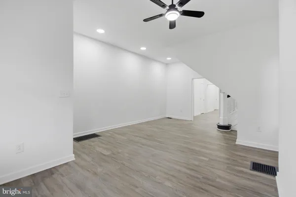 a kitchen with cabinets stainless steel appliances and a counter space