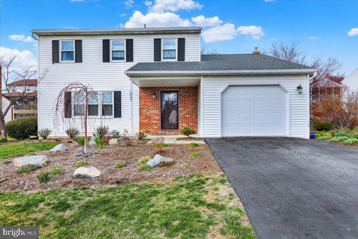 1839 Shellbark Drive Reading, PA 19608 - Photo 2 of 32 a front view of a house with a yard and garage