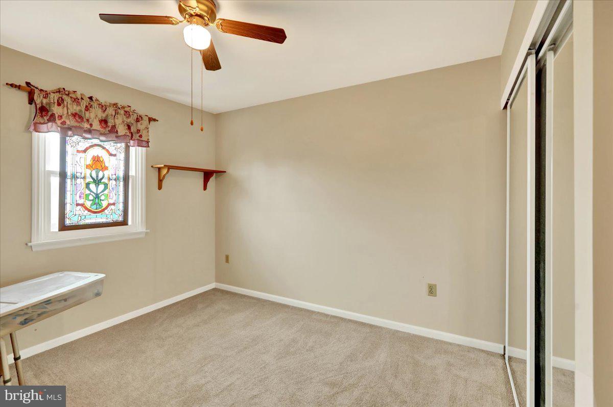 1839 Shellbark Drive Reading, PA 19608 - Photo 21 of 32 an empty room with windows and fan