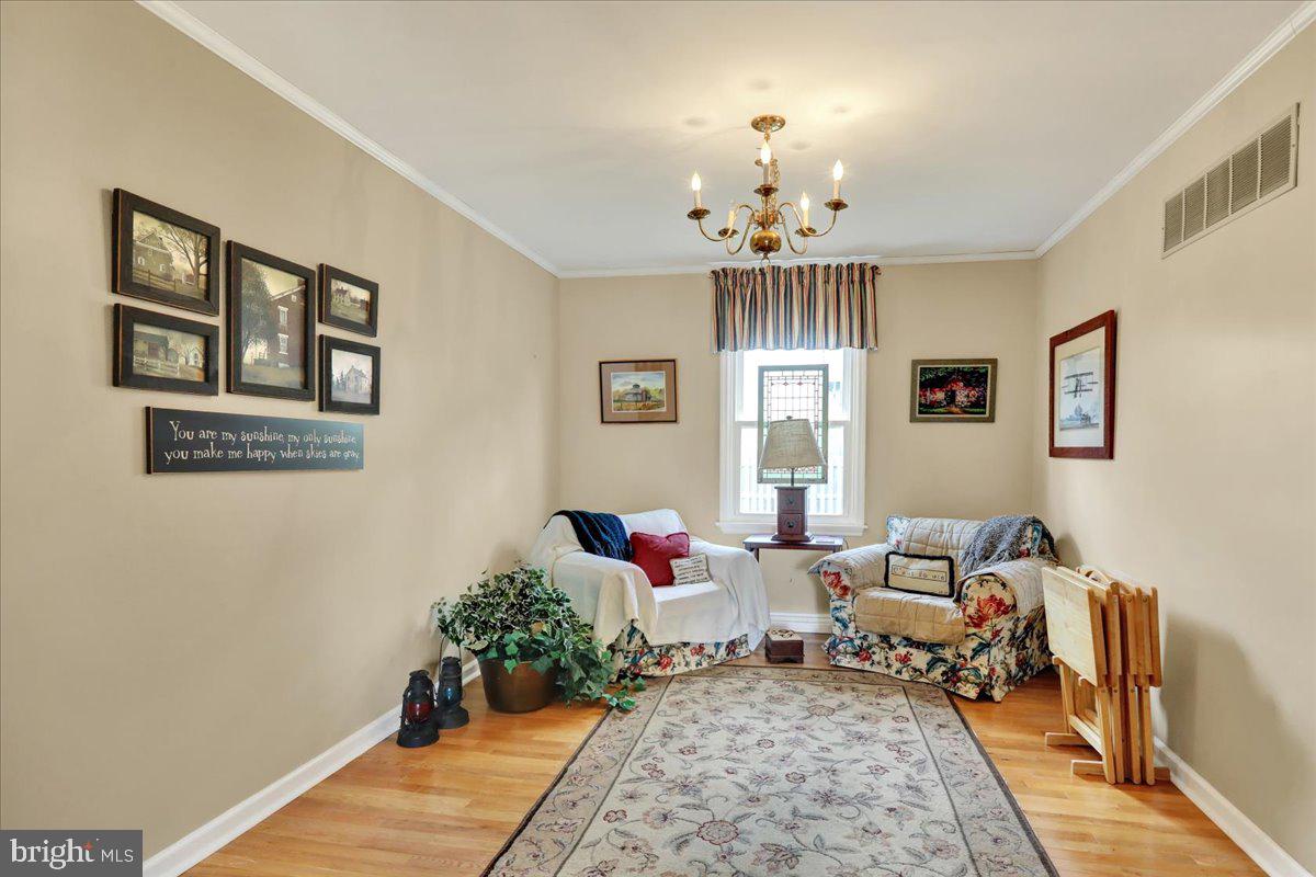 1839 Shellbark Drive Reading, PA 19608 - Photo 8 of 32 a living room with furniture and a chandelier