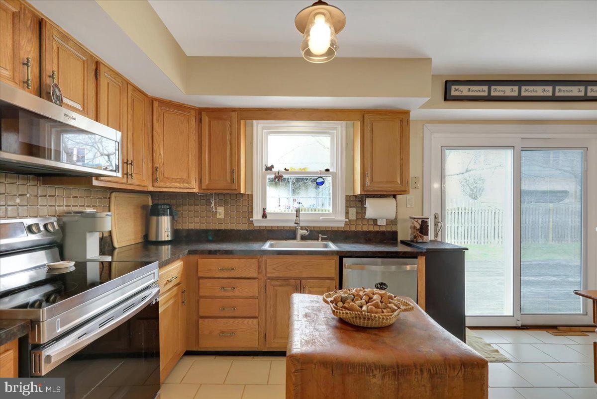 1839 Shellbark Drive Reading, PA 19608 - Photo 10 of 32 a kitchen with stainless steel appliances granite countertop a sink and cabinets