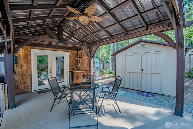 a patio with a table and chairs
