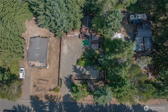 an aerial view of a house with outdoor space