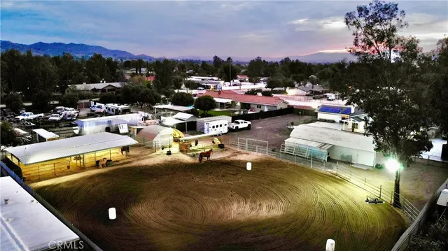 a view of a swimming pool with outdoor seating