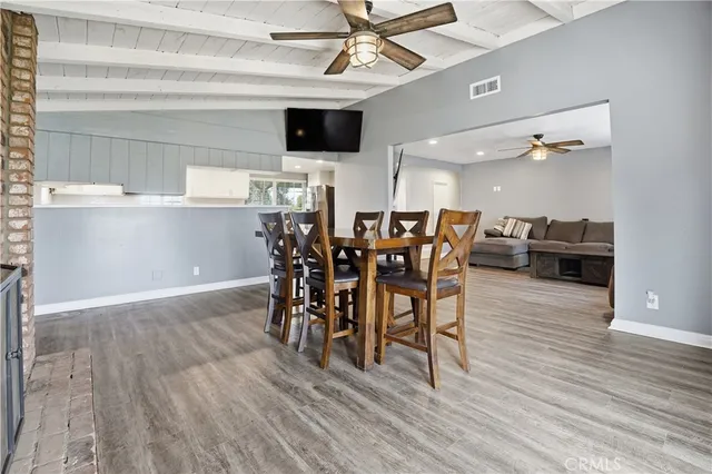 a kitchen with granite countertop sink stainless steel appliances and white cabinets
