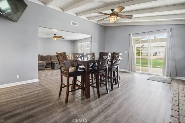 a kitchen with granite countertop white cabinets and a sink
