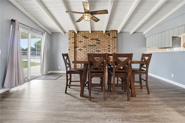 a bedroom with a bed and a television