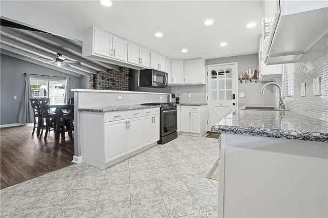 a view of walk in closet with clothes