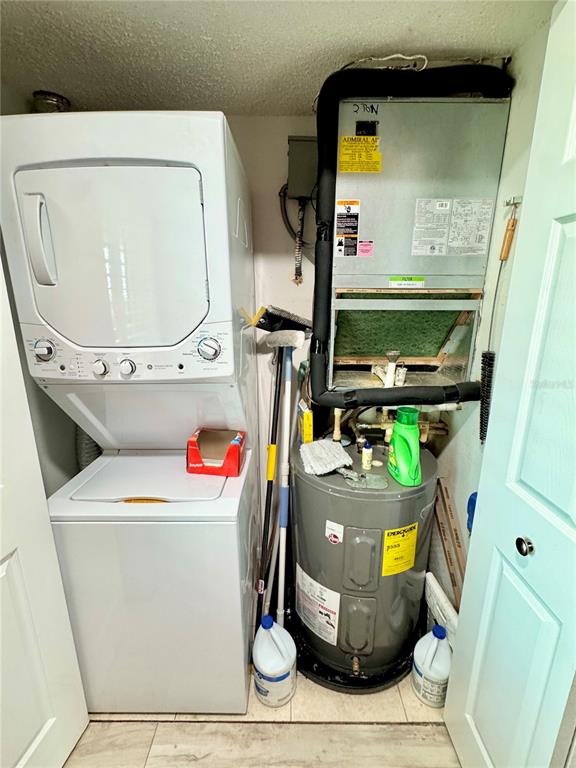 4620 Bay Boulevard, Unit 1145 Port Richey, FL 34668 - Photo 15 of 47 a utility room with dryer and washer