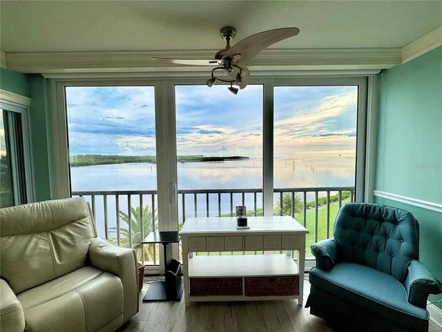 a view of a living room and floor to ceiling window and outside porch