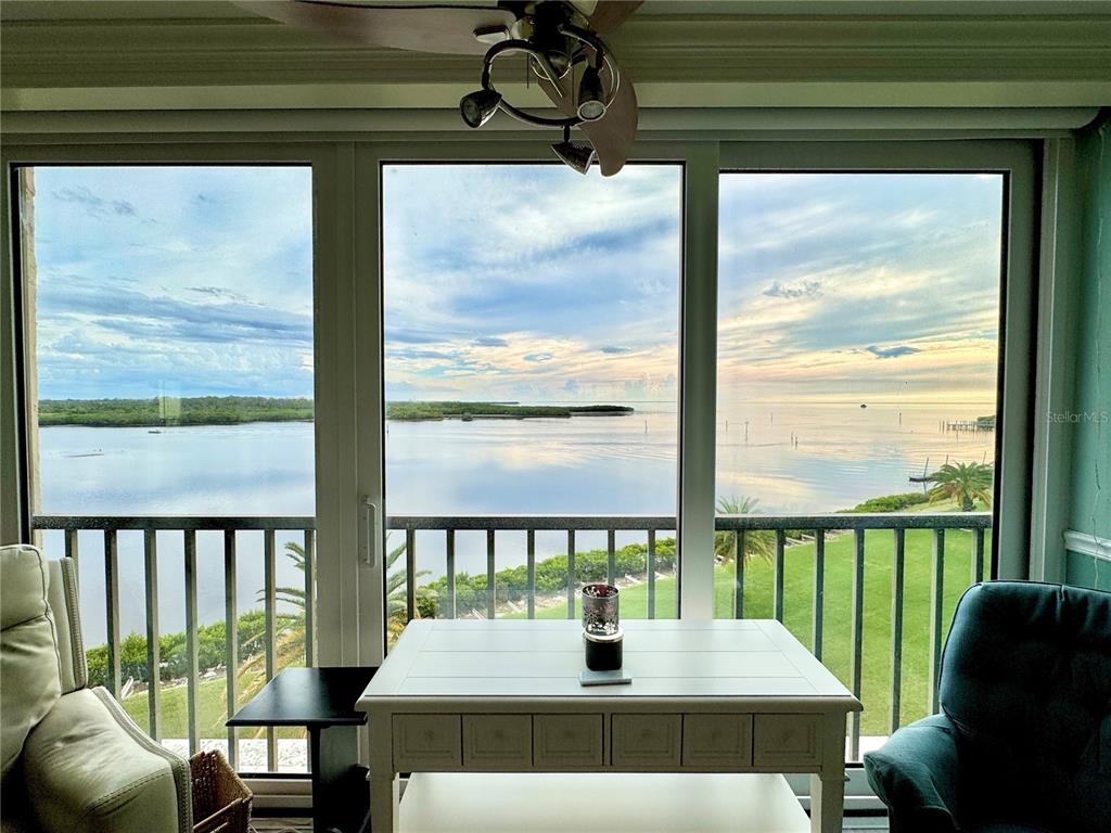 4620 Bay Boulevard, Unit 1145 Port Richey, FL 34668 - Photo 24 of 47 a view of a living room and floor to ceiling window and outside porch