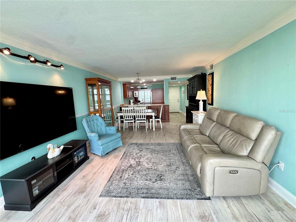 4620 Bay Boulevard, Unit 1145 Port Richey, FL 34668 - Photo 25 of 47 a living room with furniture and a flat screen tv