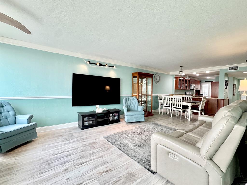 4620 Bay Boulevard, Unit 1145 Port Richey, FL 34668 - Photo 26 of 47 a living room with furniture and a flat screen tv