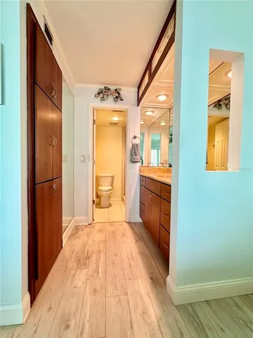 a spacious bathroom with a granite countertop sink and a mirror