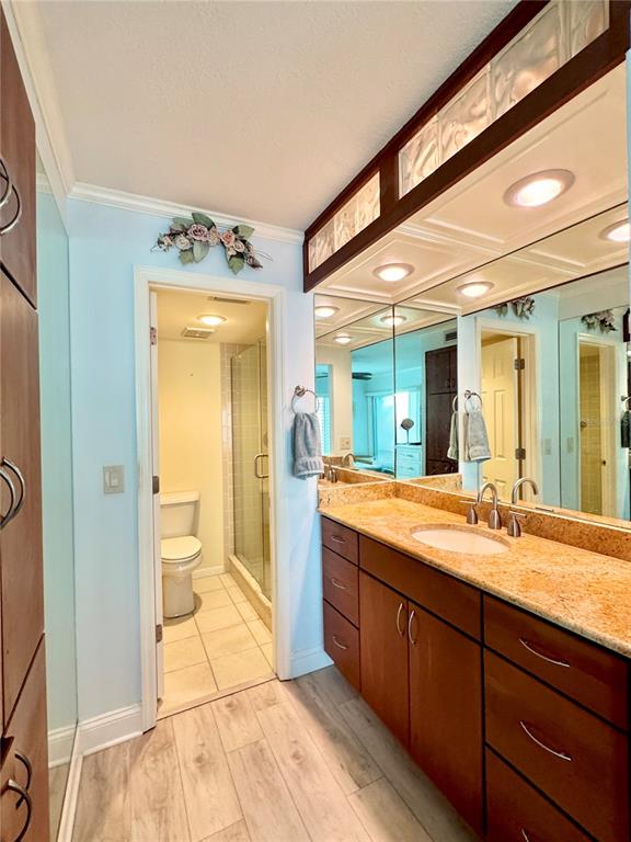 4620 Bay Boulevard, Unit 1145 Port Richey, FL 34668 - Photo 30 of 47 a spacious bathroom with a granite countertop sink and a mirror