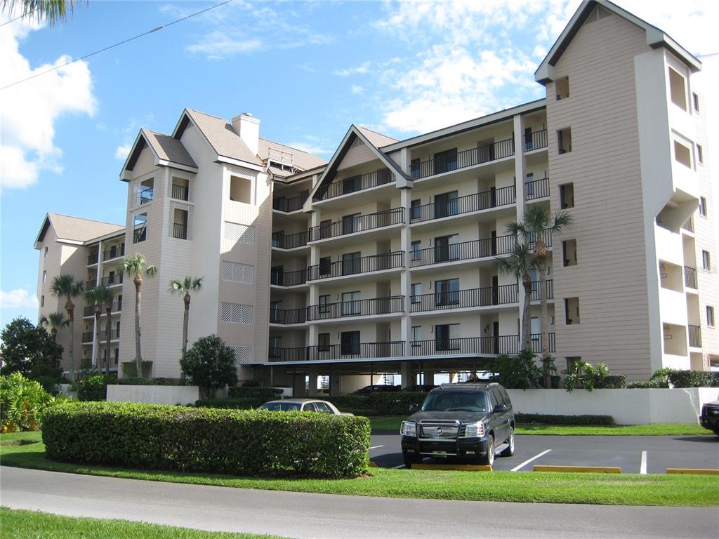 4620 Bay Boulevard, Unit 1145 Port Richey, FL 34668 - Photo 5 of 47 a front view of a building with garden