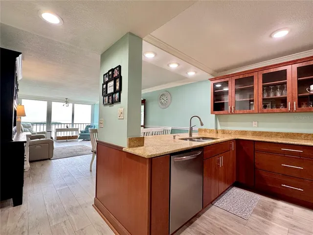 a kitchen with stainless steel appliances a stove microwave and cabinets