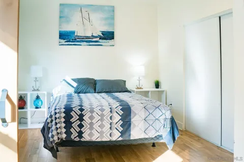 a kitchen with stainless steel appliances granite countertop a table chairs sink and cabinets