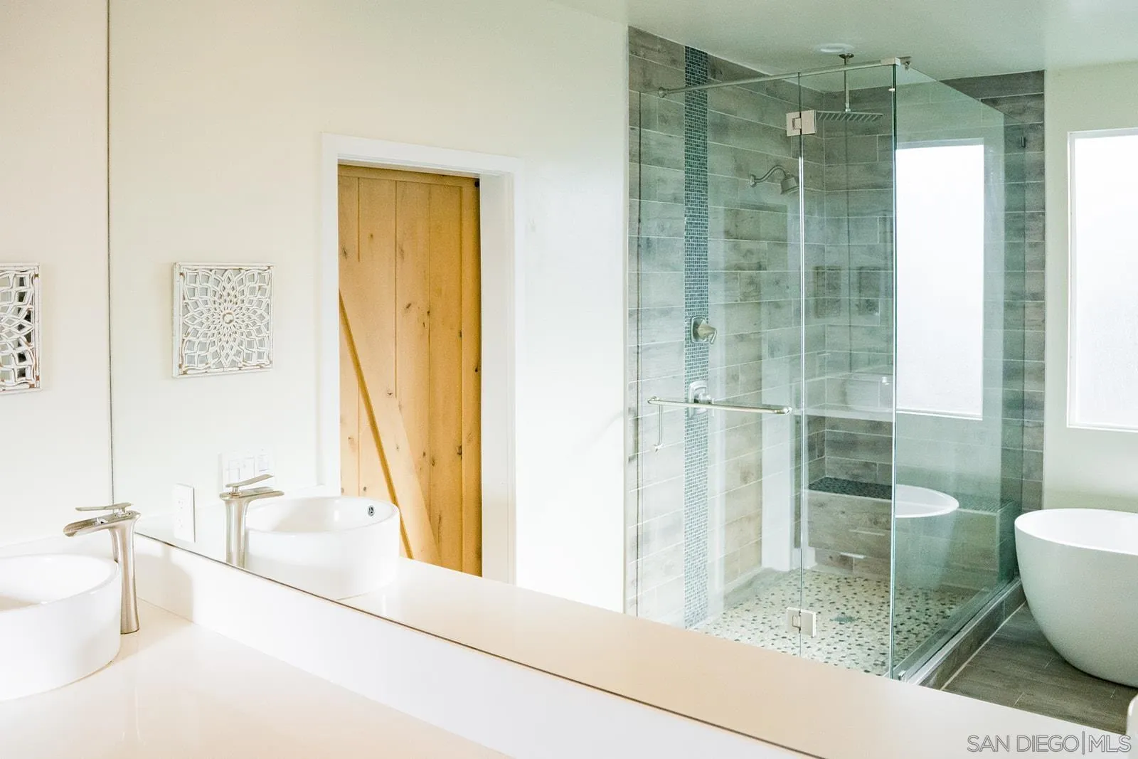 1220 Emerald Street San Diego, CA 92109 - Photo 19 of 19 a bathroom with a tub and shower