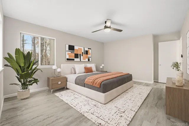 a bedroom with a large bed and a couch