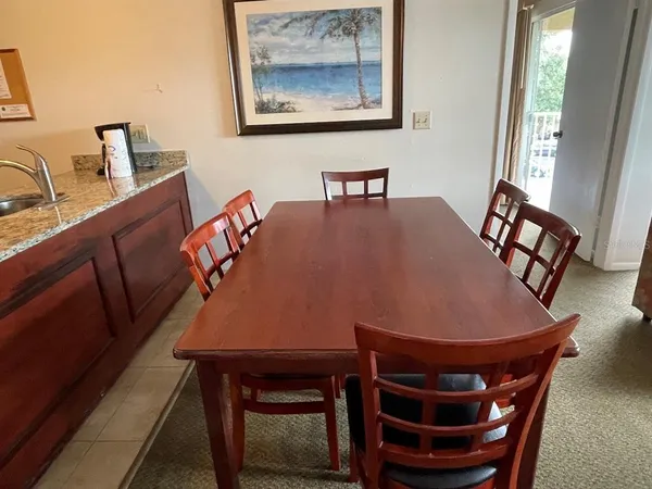 a view of a dining room with furniture