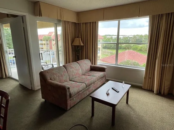 a living room with furniture and a window
