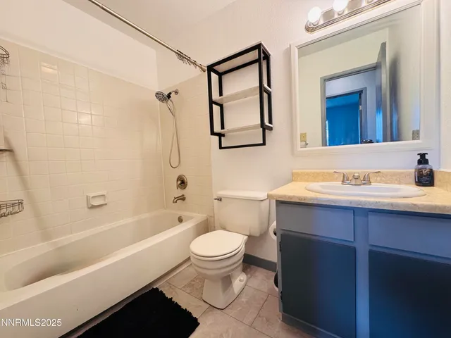 a bathroom with a sink a toilet and a bathtub