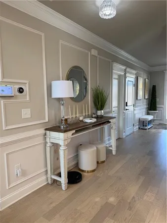 a kitchen with granite countertop white cabinets and stainless steel appliances