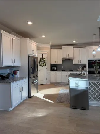a living room with furniture and a mirror