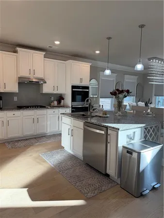 a living room with furniture fireplace and a fireplace