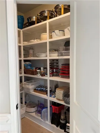 a living room with furniture a fireplace and a window