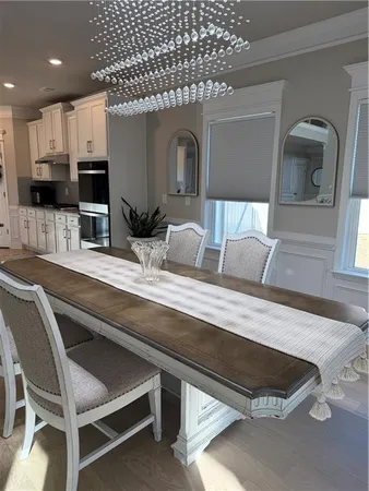 a living room with a couch and a potted plant