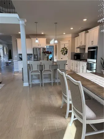 a utility room with sink dryer and washer