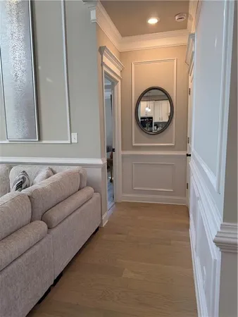 a view of empty room with wooden floor