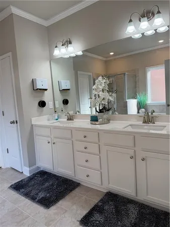 a white toilet sitting next to a white wall