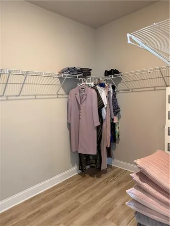 a view of a livingroom with wooden floor and stairs