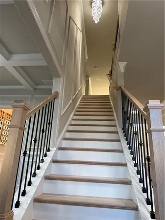 a bedroom with furniture and wooden floor