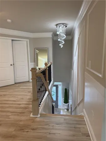 a living room with furniture and large windows