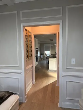 a kitchen with stainless steel appliances kitchen island granite countertop a sink a stove and cabinets