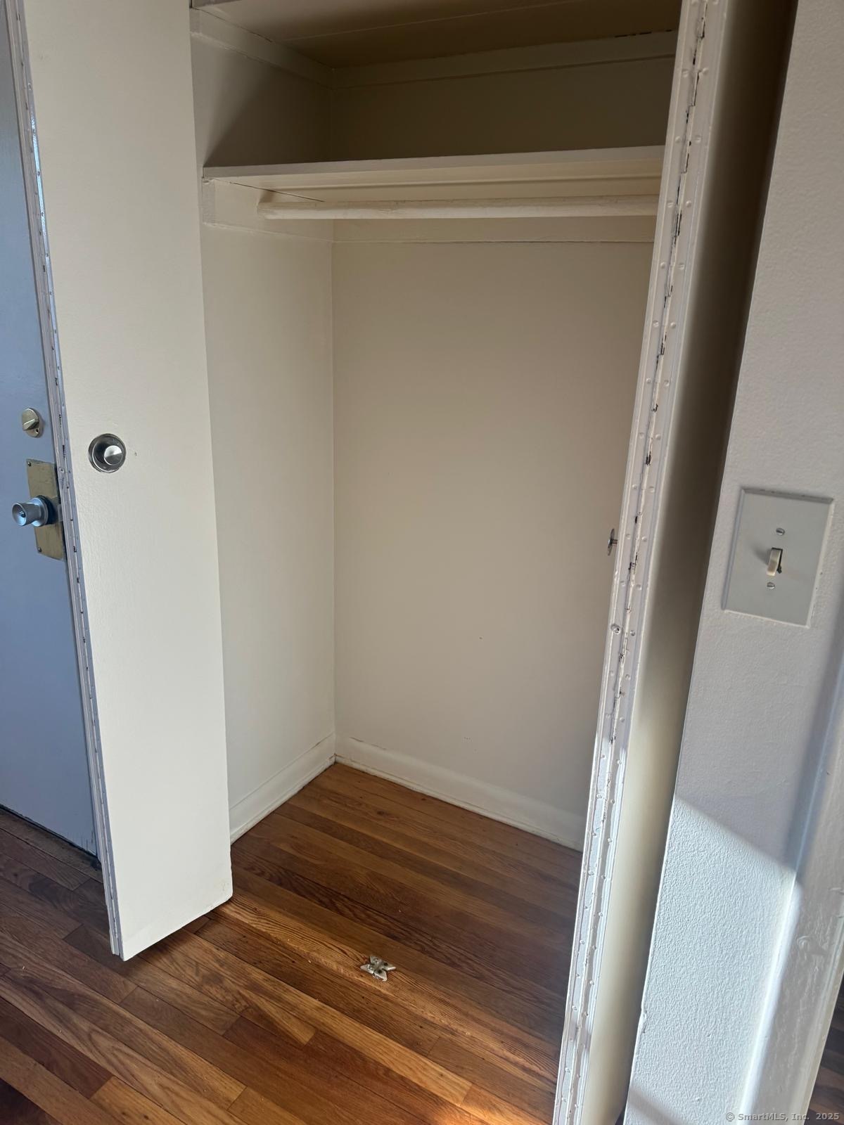 155 McKinley Avenue, Unit 15A Bridgeport, CT 06606 - Photo 3 of 5 a room with a hardwood floor