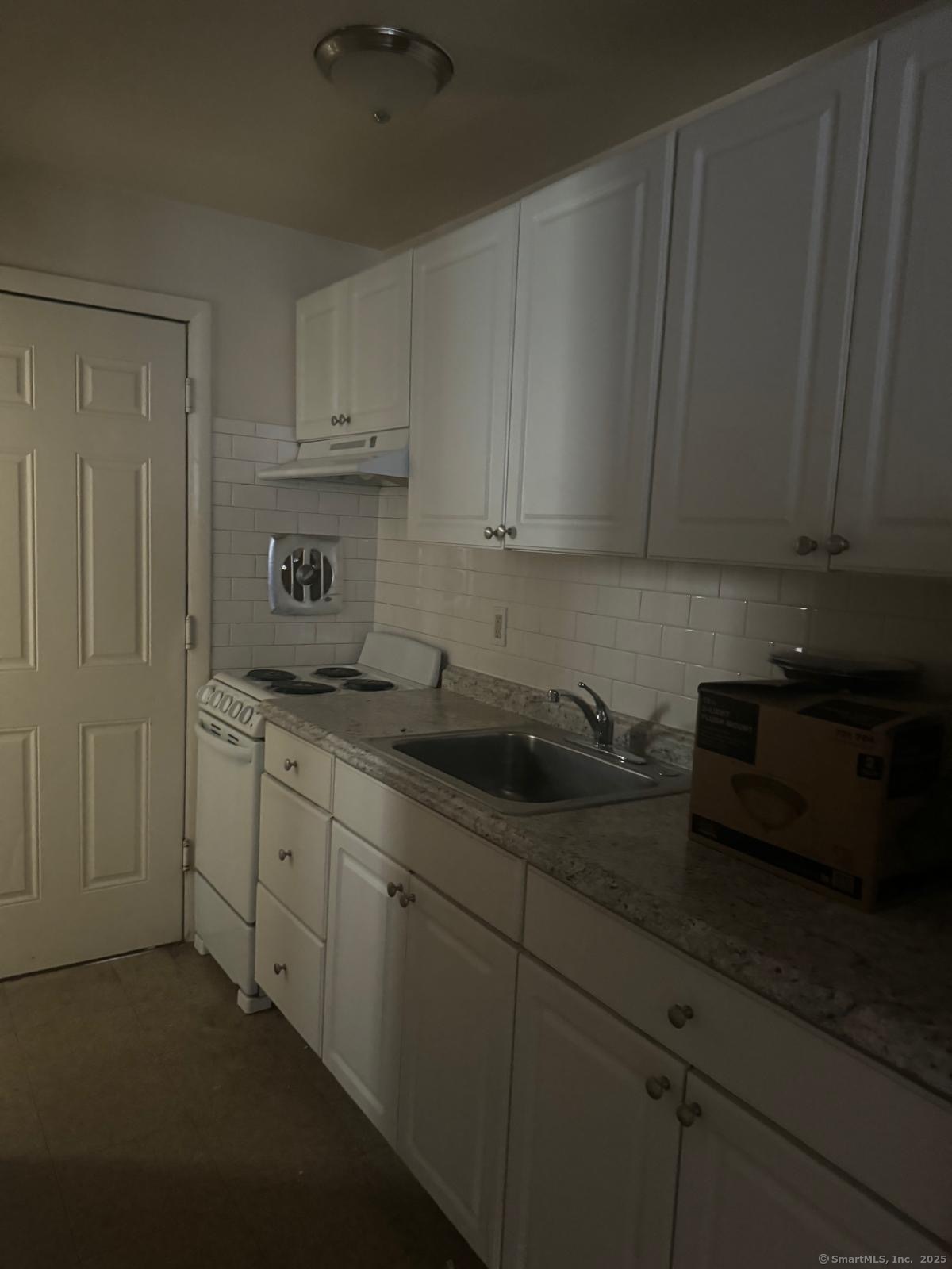 155 McKinley Avenue, Unit 15A Bridgeport, CT 06606 - Photo 5 of 5 a kitchen with a sink and cabinets