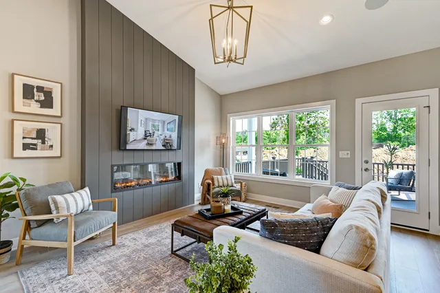 a living room with furniture and a window