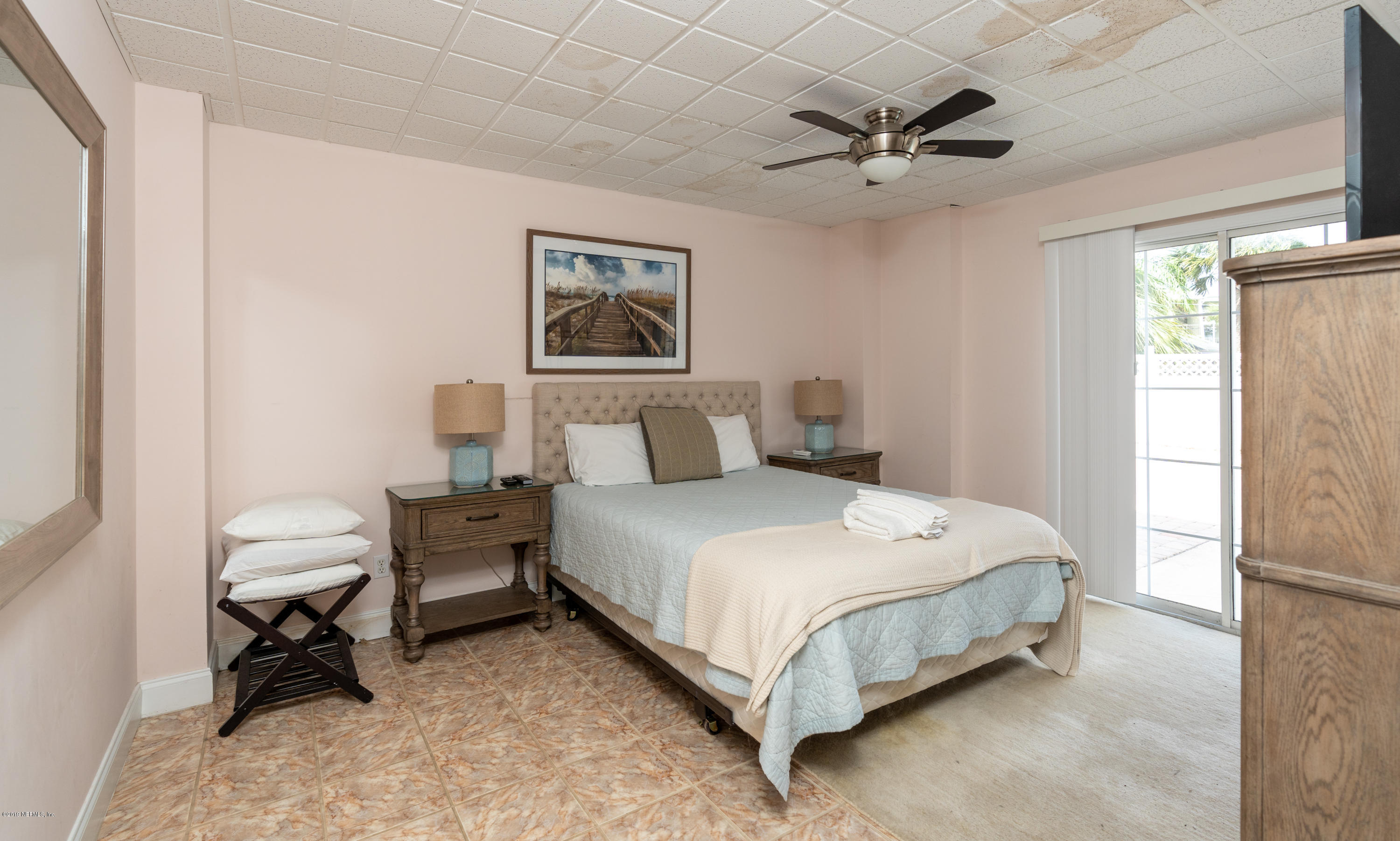 4 3rd Street St. Augustine, FL 32080 - Photo 13 of 47 a bedroom with a bed and a window