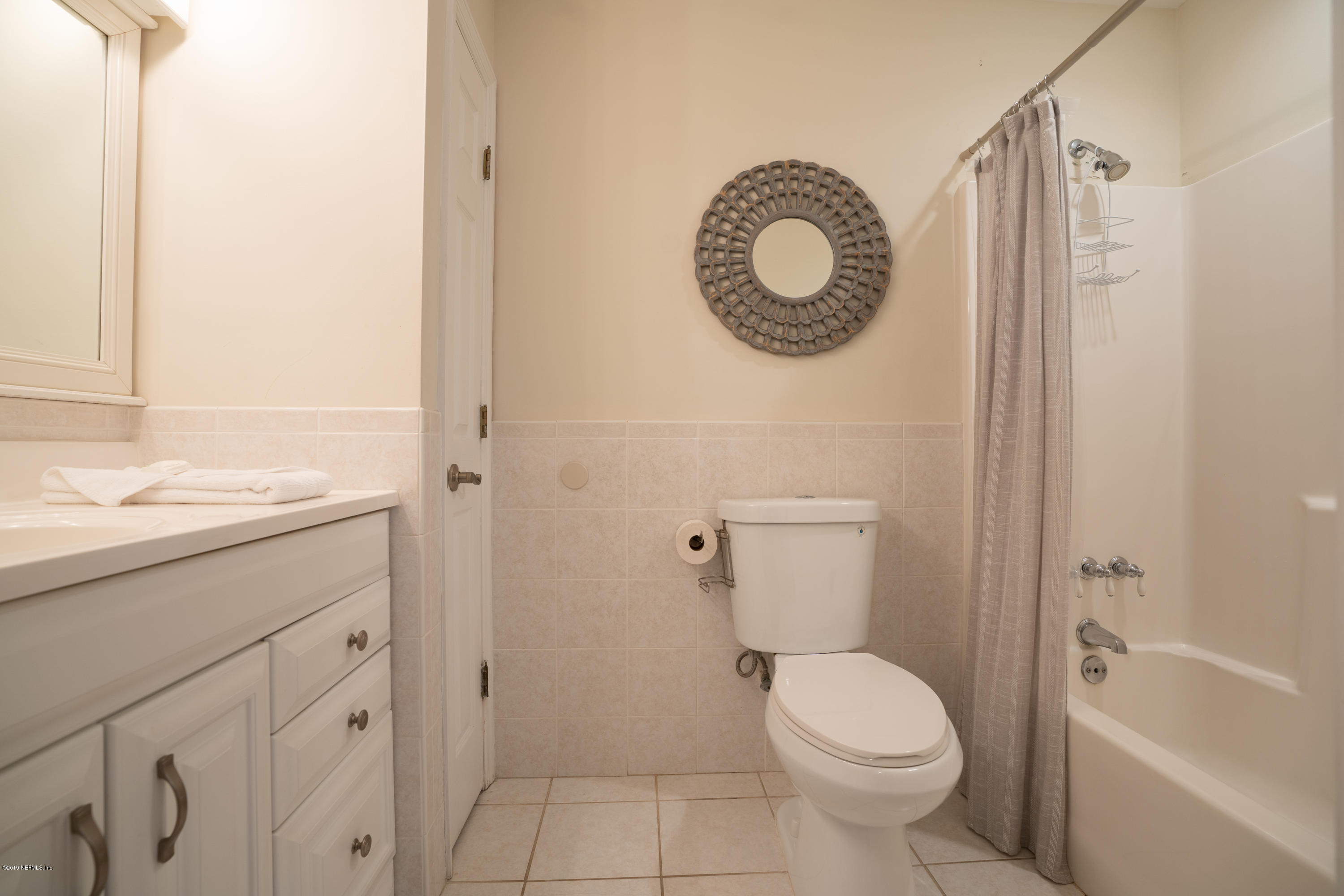 4 3rd Street St. Augustine, FL 32080 - Photo 15 of 47 a bathroom with a toilet sink vanity and tub