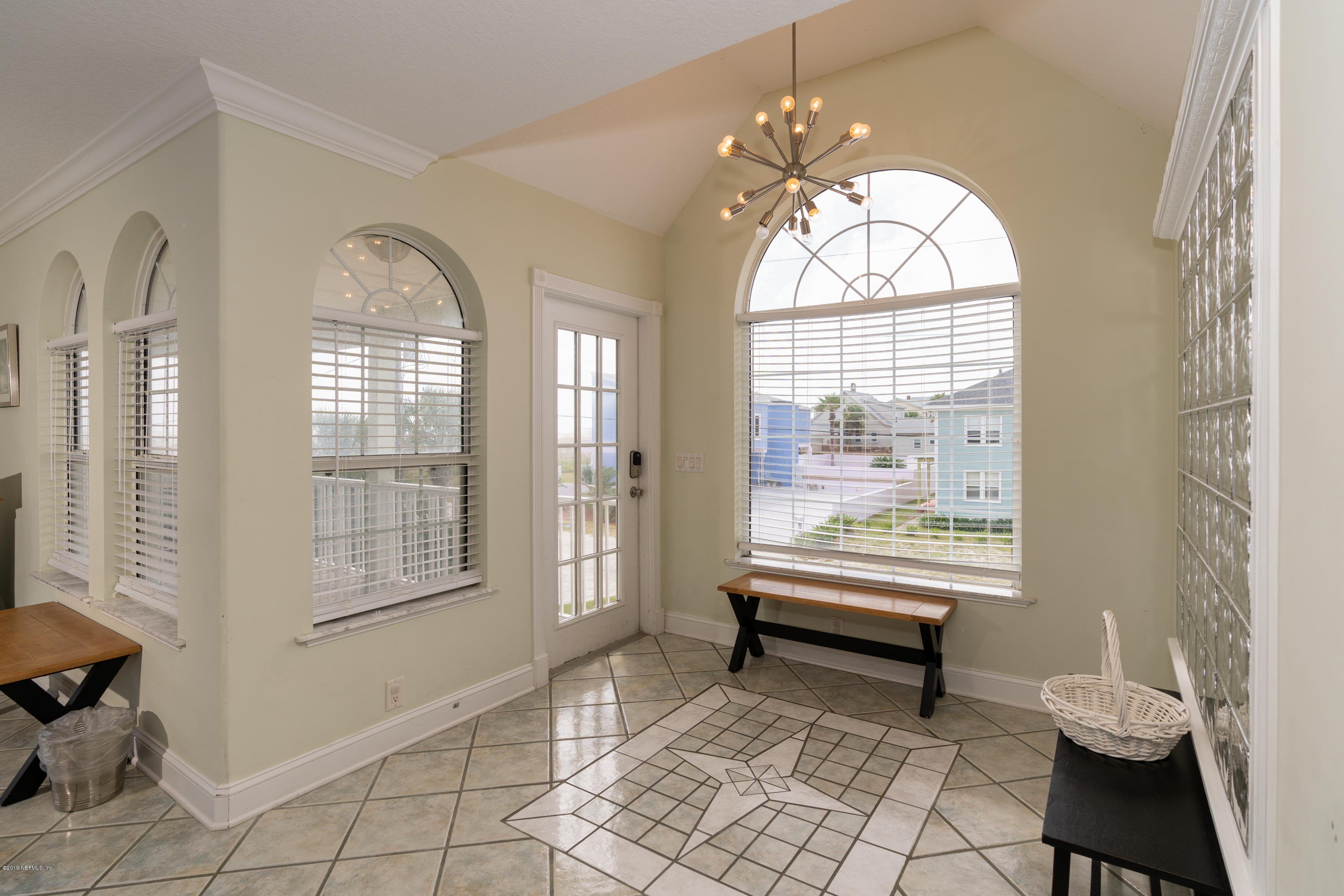 4 3rd Street St. Augustine, FL 32080 - Photo 17 of 47 a living room with furniture and a floor to ceiling window