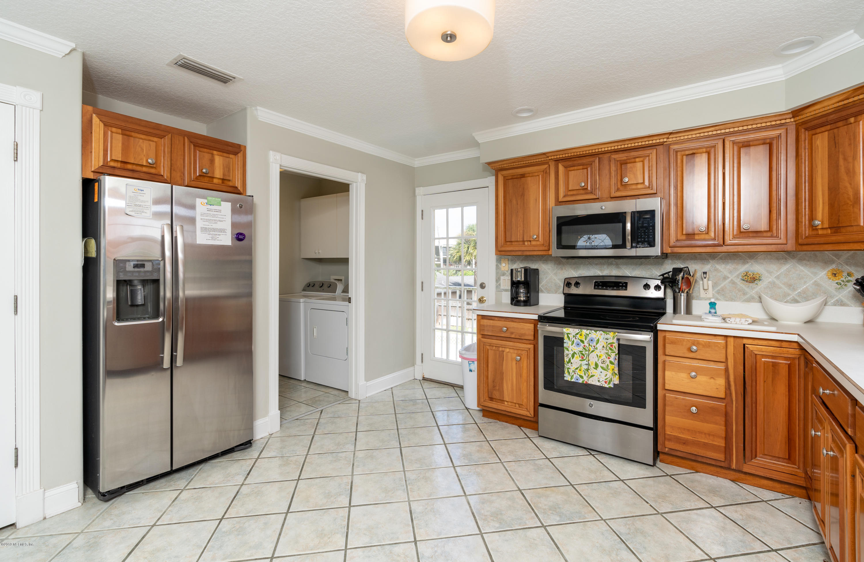 4 3rd Street St. Augustine, FL 32080 - Photo 23 of 47 a kitchen with stainless steel appliances granite countertop a refrigerator and a stove top oven